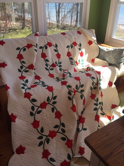 Mom's hand-quilted Tulips quilt hanging on the back porch at the lake house. Photo: Marianne Fons
