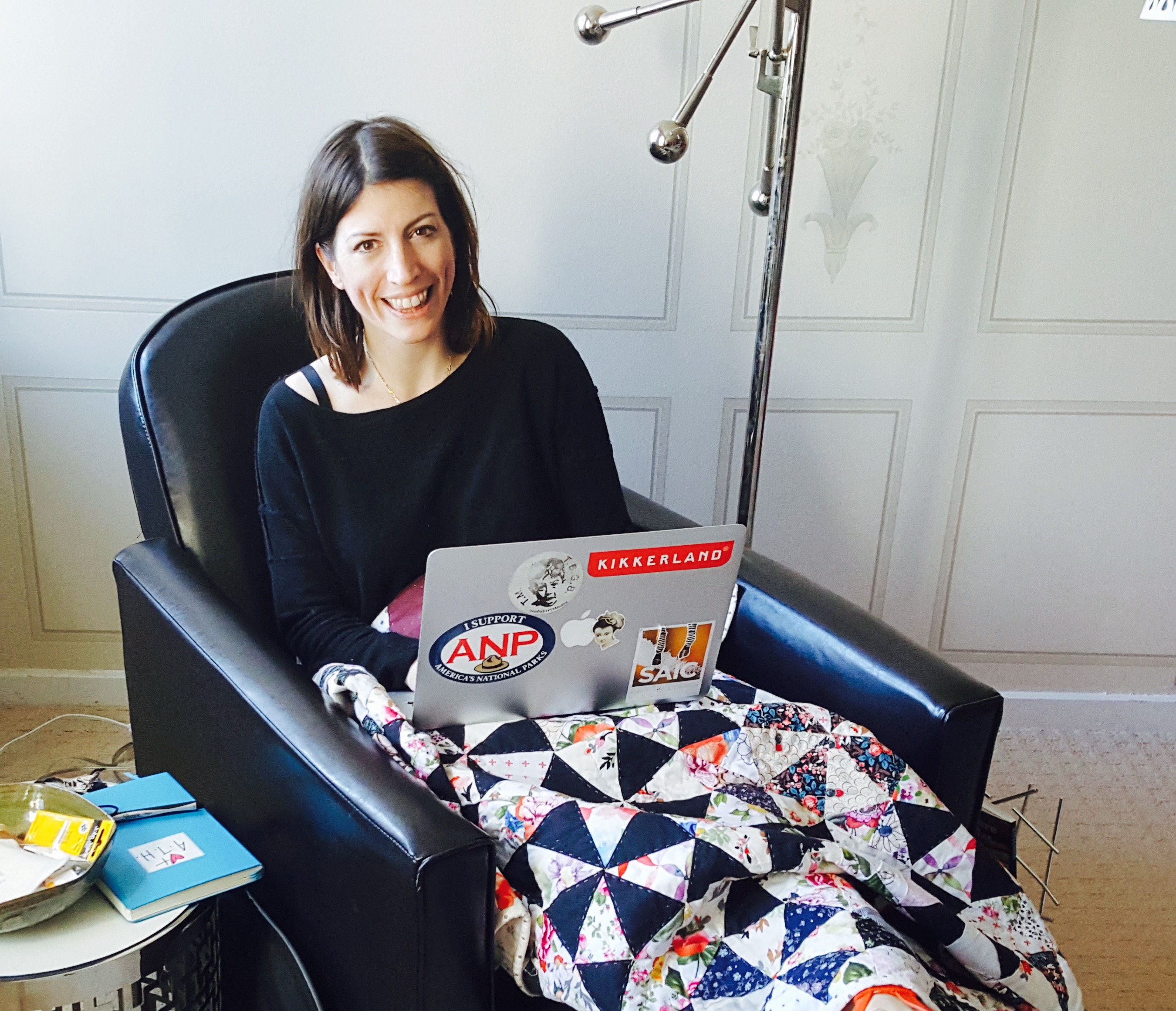 That's my hand-quilted "Larkin" quilt on my lap while I write this blog! Photo: Ebony Love.