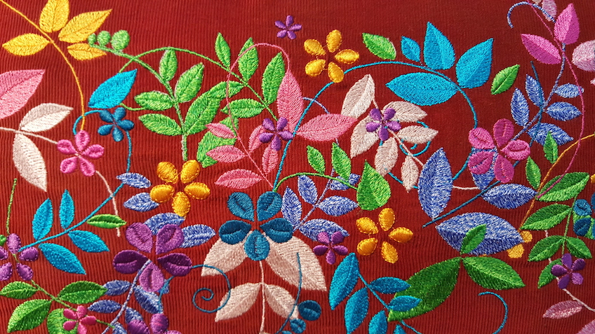 Embroidered pillow, detail. AE Gutterman booth at 2016 Fall Quilt Market, Houston TX. Photo: Me.
