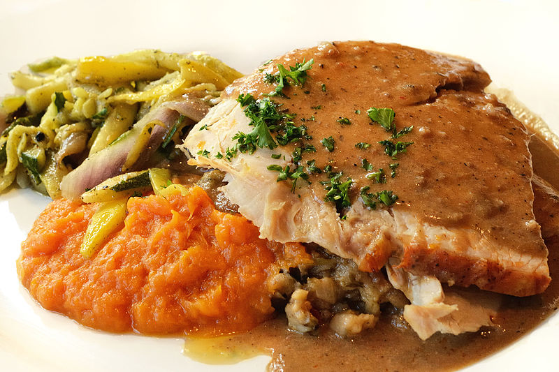 Roasted turkey with French bread dressing, bourbon whipped sweet potatoes, grilled autumn vegetables and giblet gravy. Photo: Wikipedia.