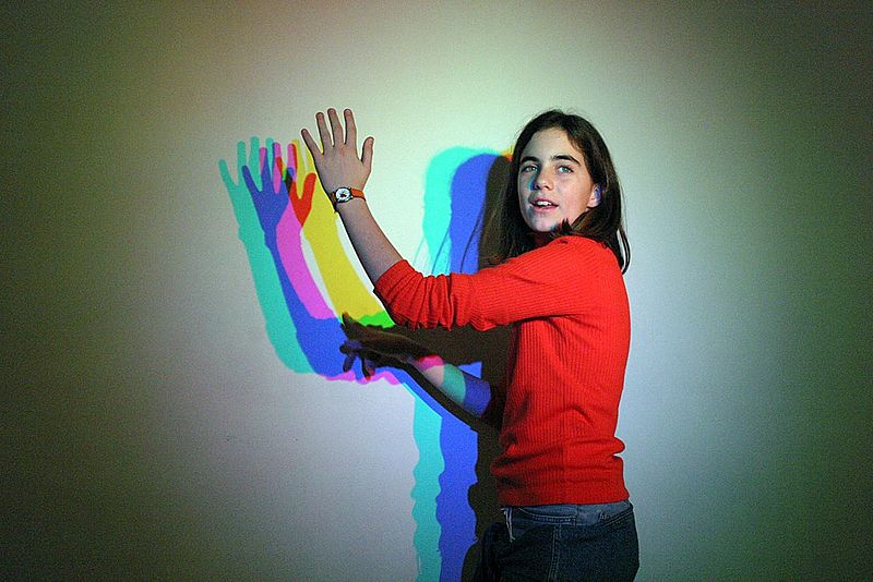Teenager in Italy, playing with light display. Image: Wikipedia. 