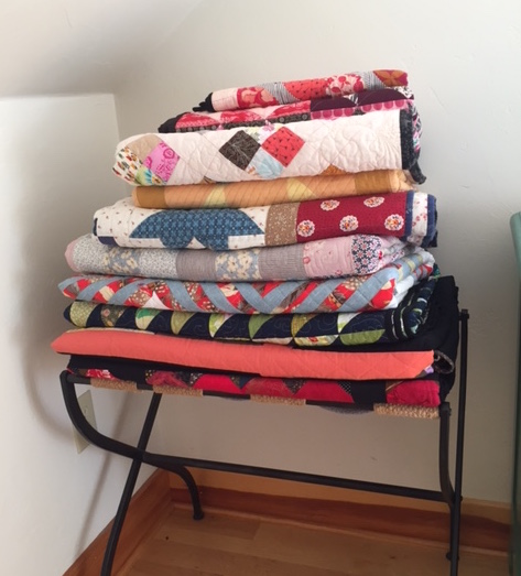 A stack of quilts does no one any good, really — unless it can do a LOT of good! Photo: Marianne Fons.